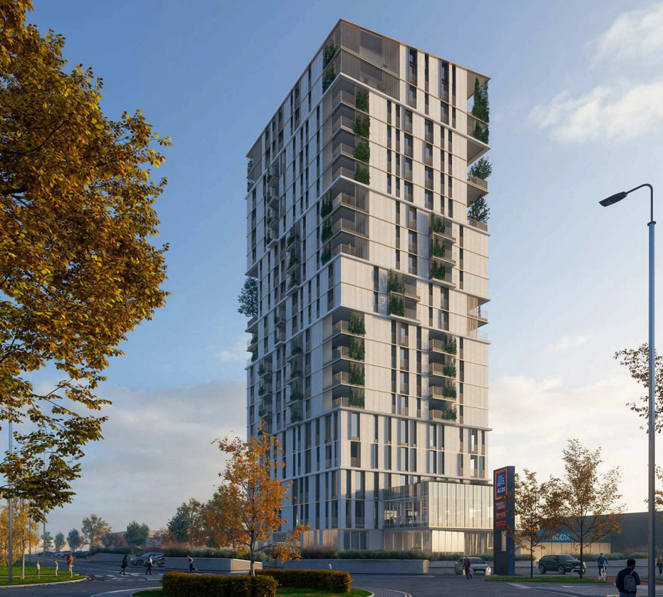 Grattacielo residenziale moderno con balconi verdi e facciata chiara a rotonda di giorno